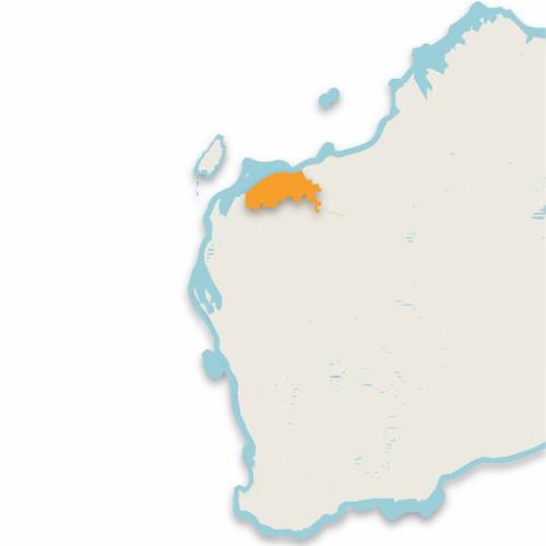 A map of the island of guam with an orange dot.