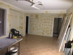 A room with yellow paint on the walls.