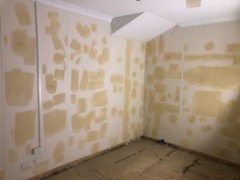 A room with some white paint on the walls