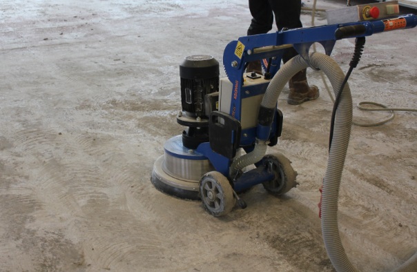 A machine is cleaning the floor of an apartment.